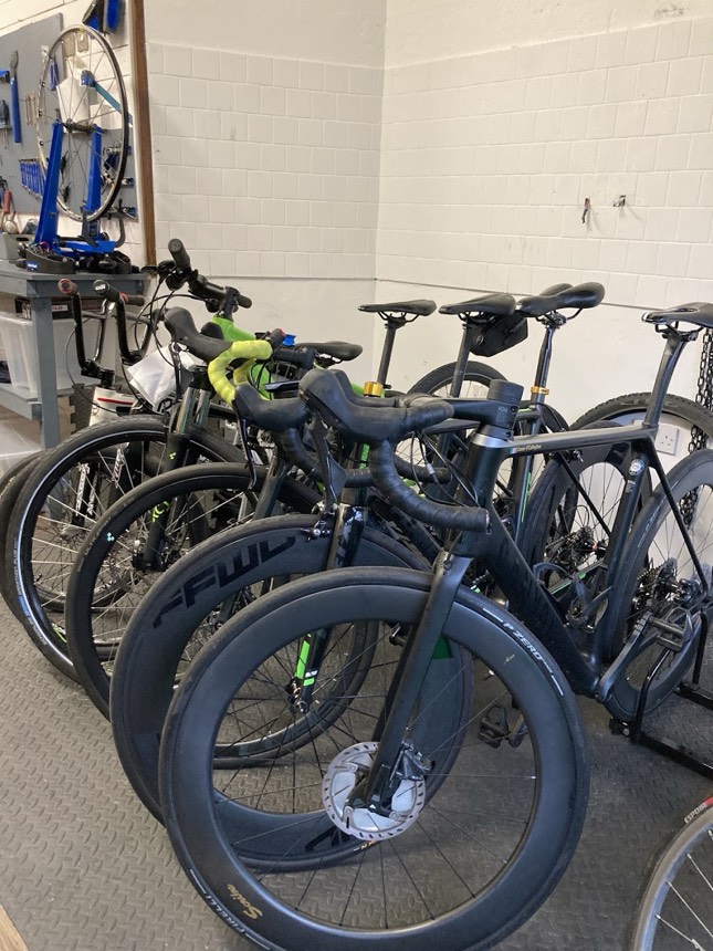 A line of road bikes waiting in the Way Cycles workshop