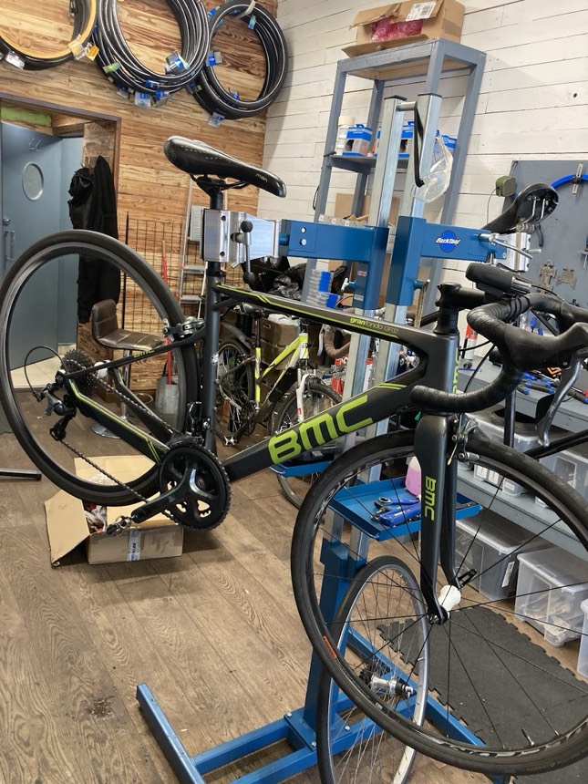 Road bikes on repair stands in the workshop