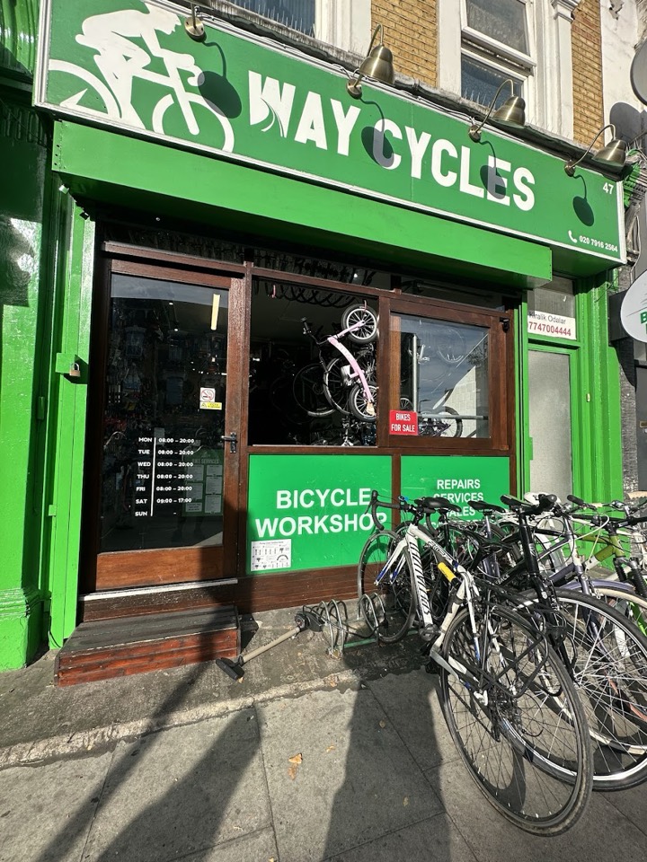 The green Way Cycles shopfront with bikes outside